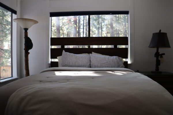 A close-up shot of the bed and the bed lamps